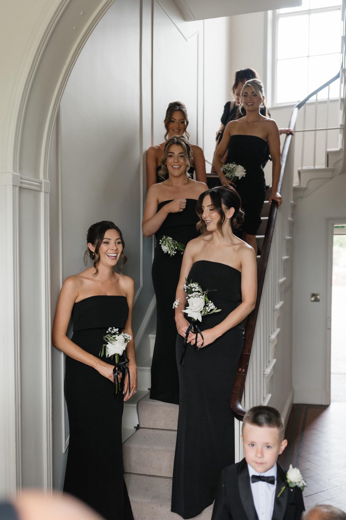 Bridesmaids with modern soft updos and face-framing pieces